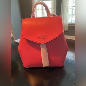 Brand new with tags hot pink Kate Spade small backpack. Excellent condition.